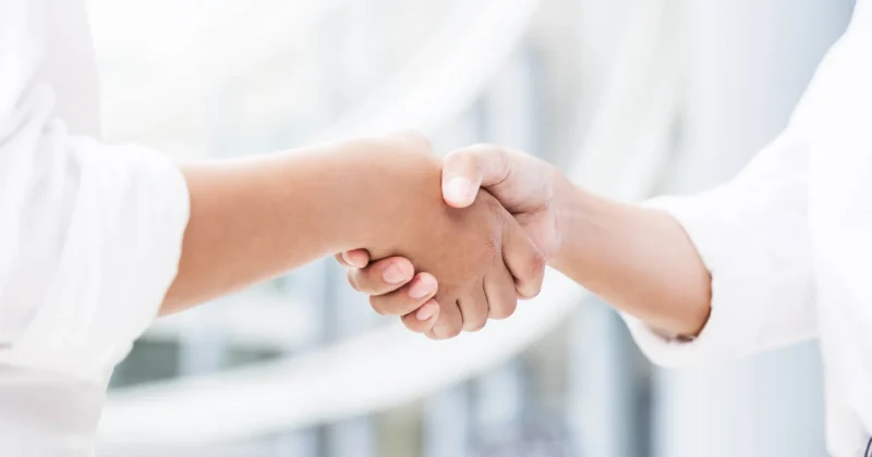 Image of two shaking hands